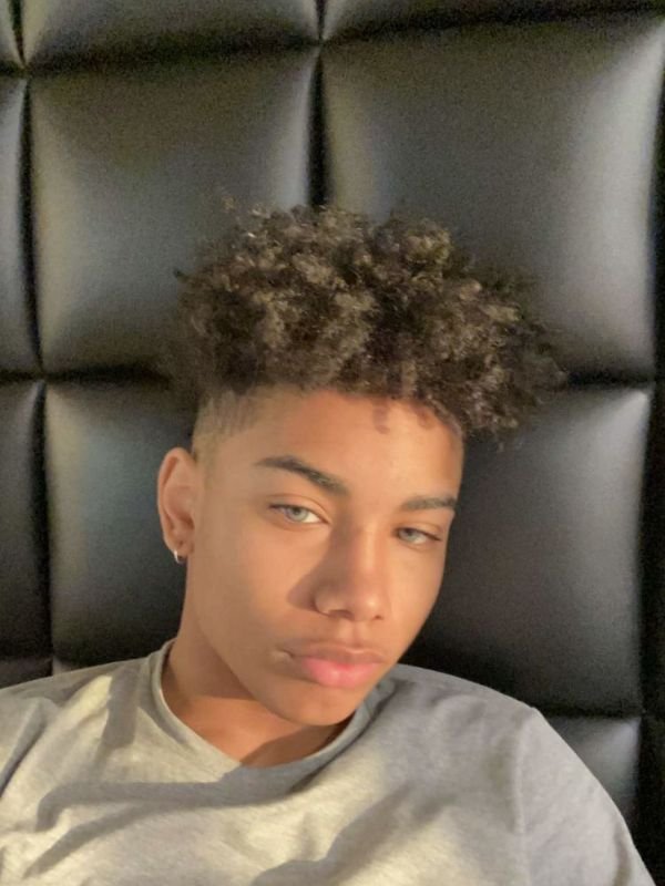 Dyed Curls with Mid Taper Fade